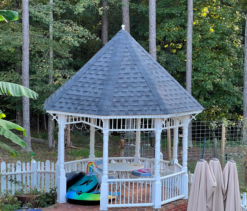 Titan Roofing Pros logo and house w/ contact information.